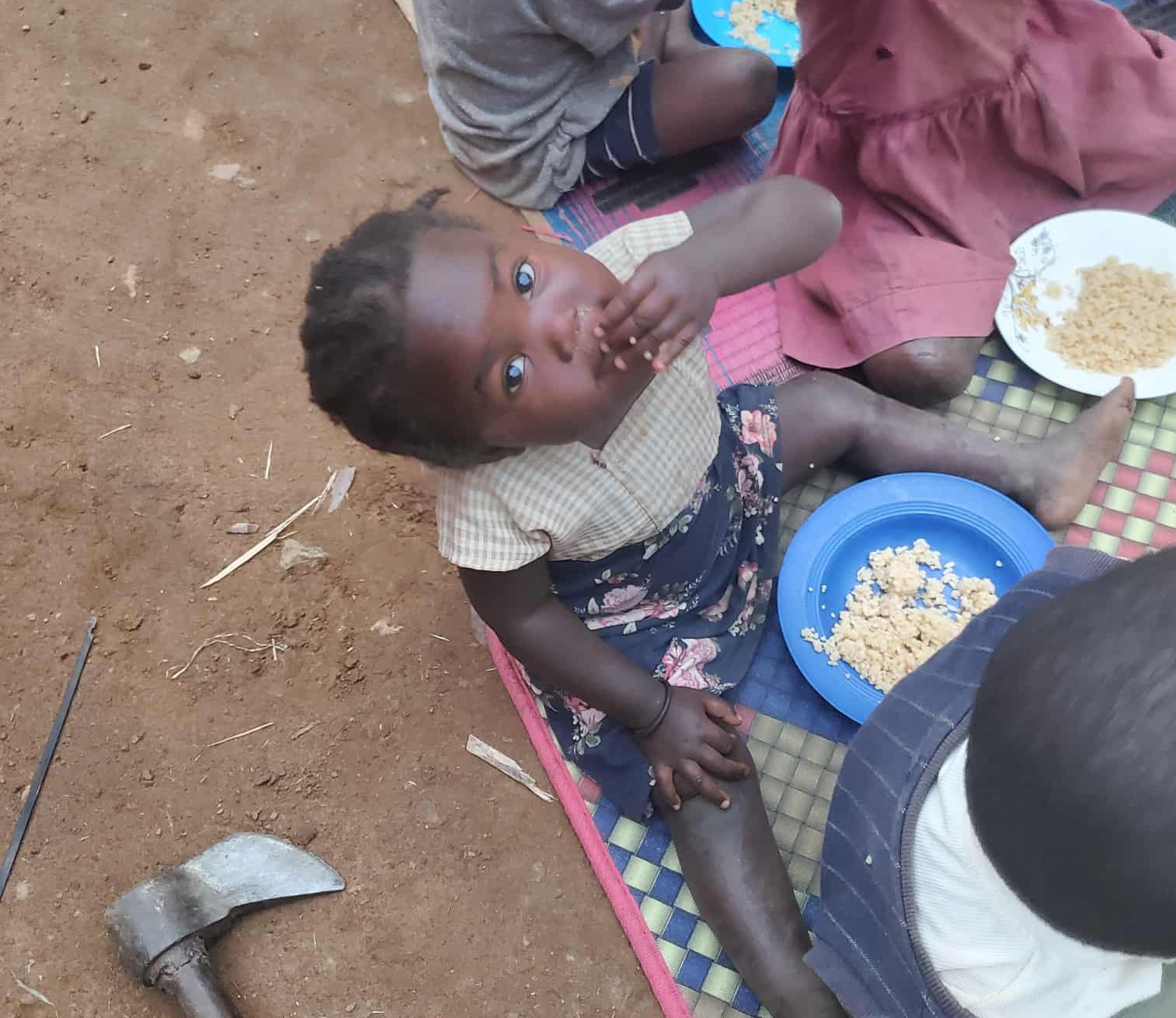 A family sharing a meal in the community.
