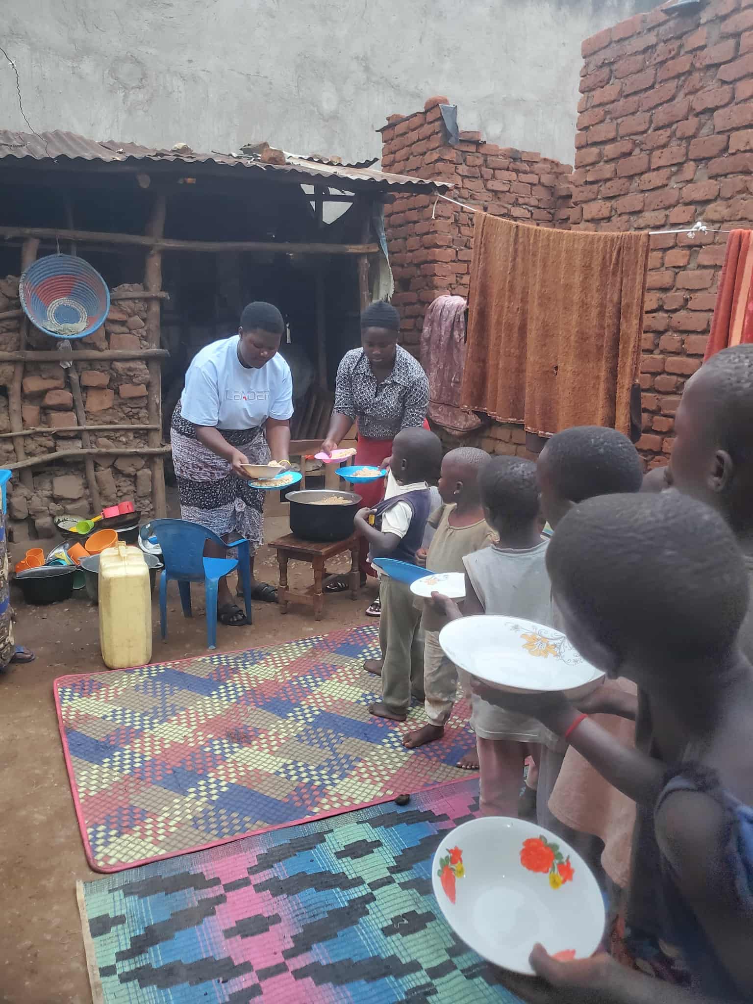 A crowd waiting for food distribution.